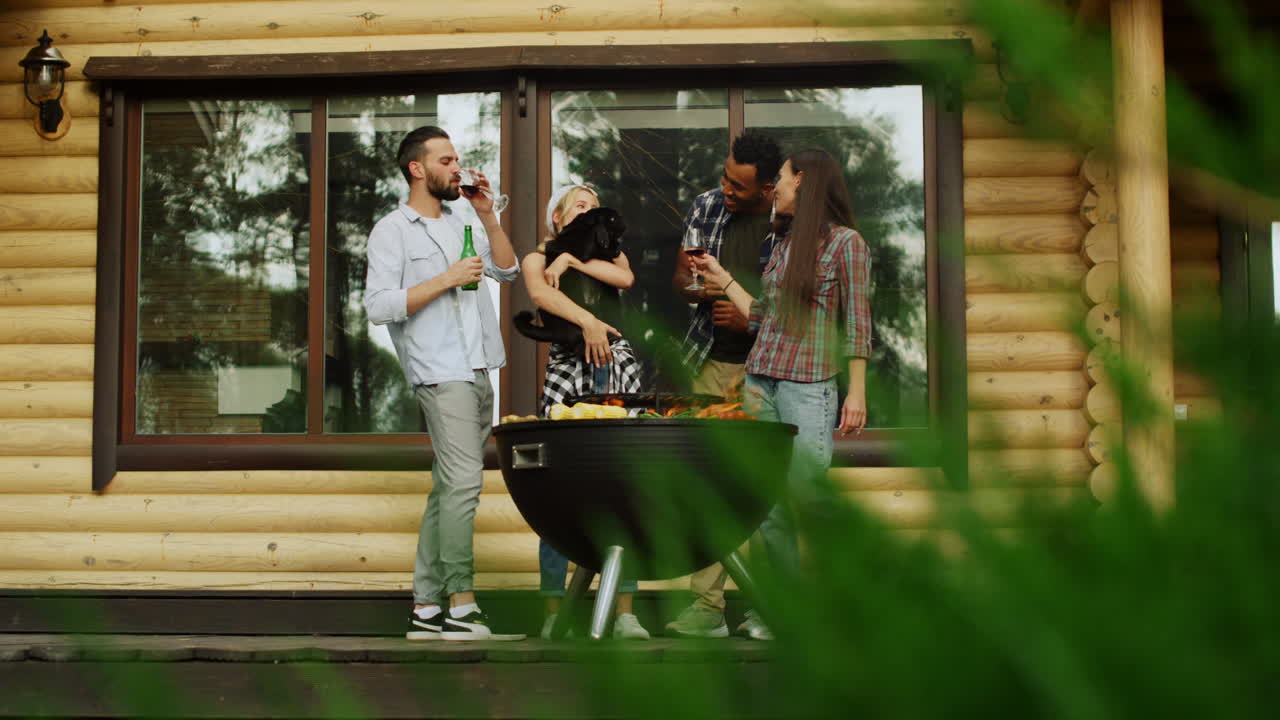 Playful fellows having fun with dog outside. Man giving wine for woman outdoors