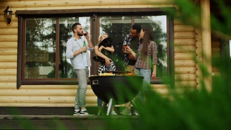 playful fellows having fun with dog outside. man giving wine for woman outdoors