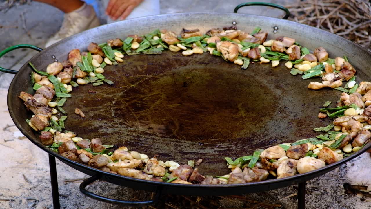 Frying ringredients for paella dish