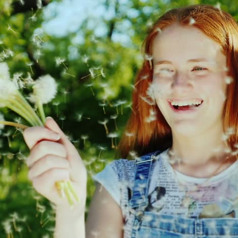 a teenage girl blowing a dandelion flower