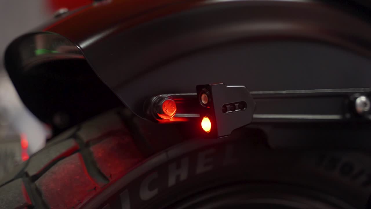 Close-up of a motorcycle's rear light and fender