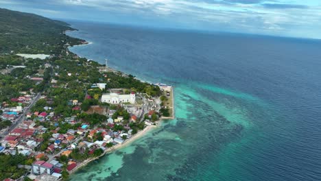 cuartel ruins, quartel beach, and church on coast of oslob in cebu, philippines