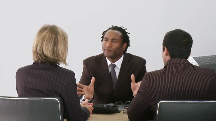 Businessman talking with his associates