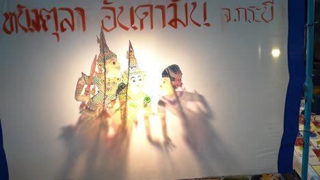 traditional asian shadow puppetry on village street in thailand, nang yai