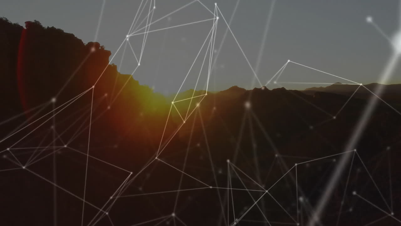 Data processing animation with network connections over mountain landscape at sunset