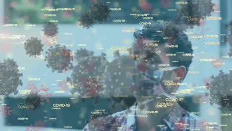 Animation-of-coronavirus-text-and-cells-over-man-wearing-face-mask