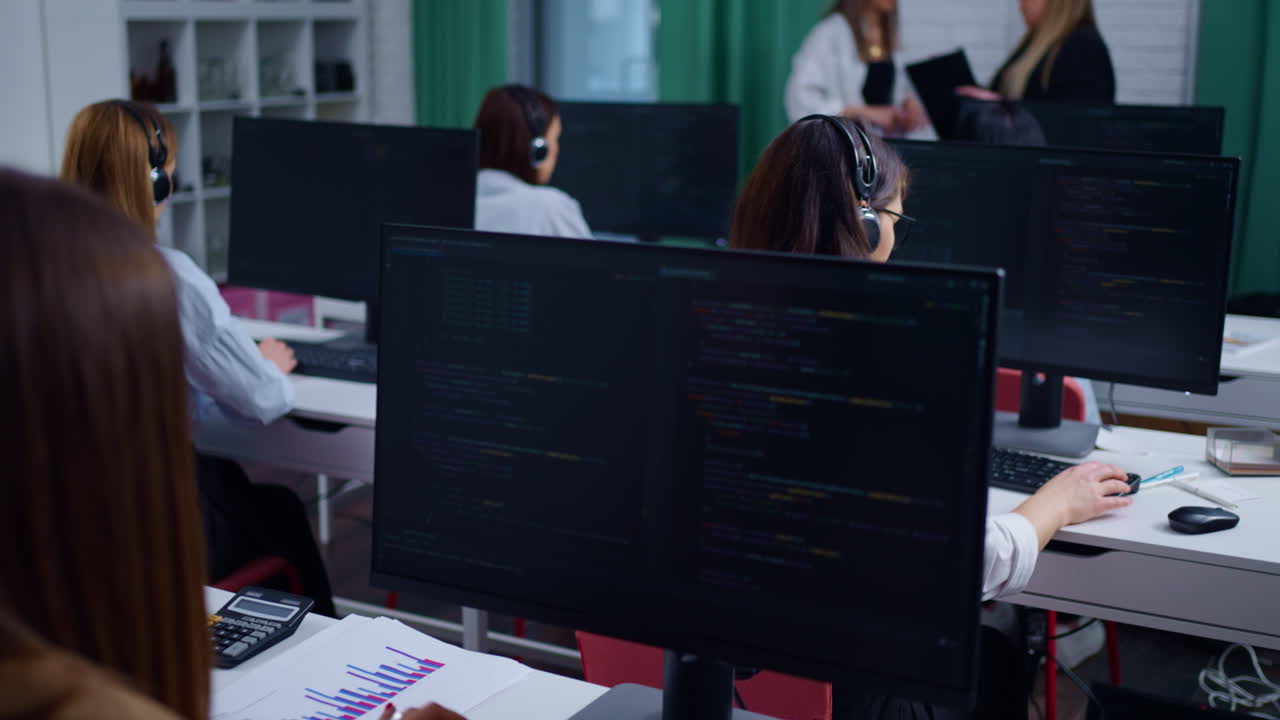 A team of women programmers working in an office
