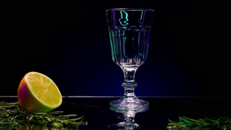 vibrant green cocktail with lemon and rosemary