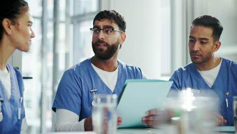 three medical professionals in a meeting