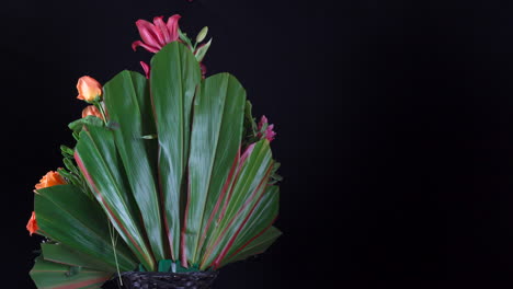 hawaiian tropical sunflower rose lily flower arrangement spinning in black background