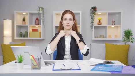 home office worker woman looks at camera with happy and smiling face.