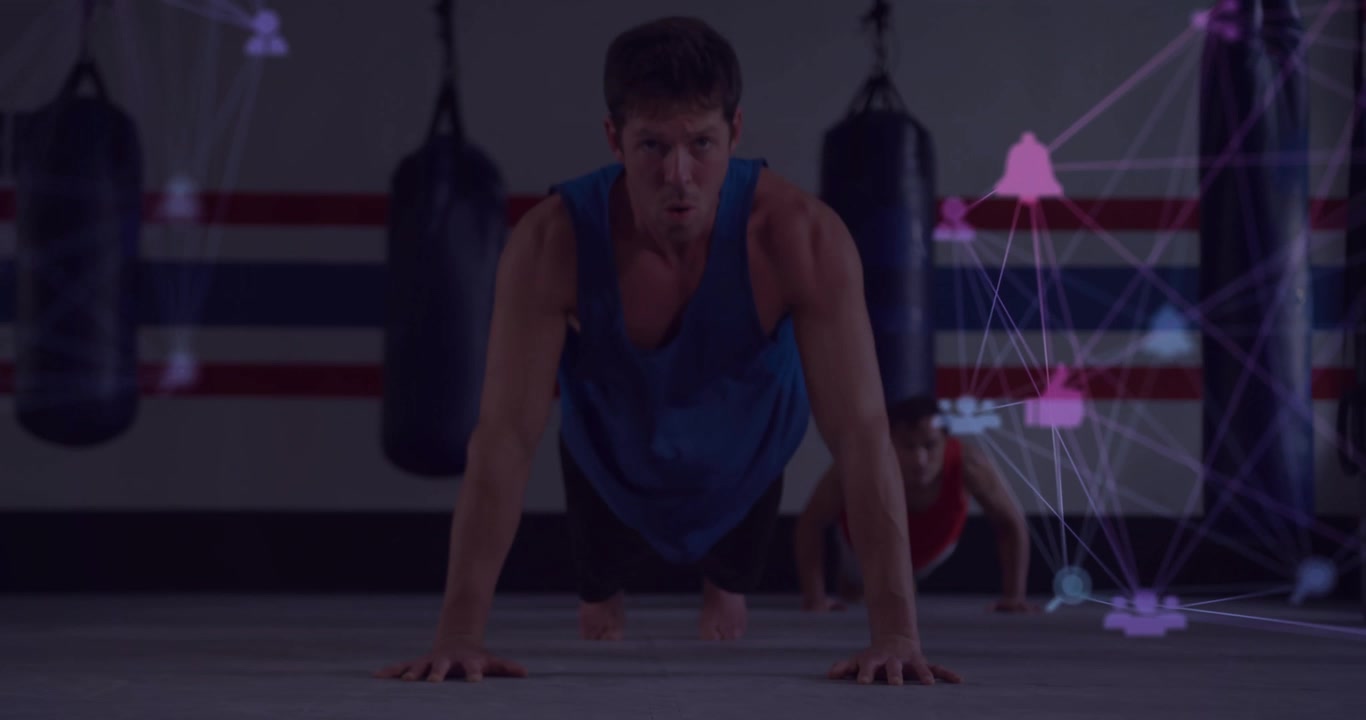 Lead subject lowering chest initiating fitness tracking overlay training with partner on gym floor