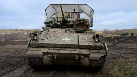 this m2 bradley ifv serves a dual role in ukraine's army. the medical cross marks it for casualty evacuation (casevac), while cage armor is vital for surviving drone warfare