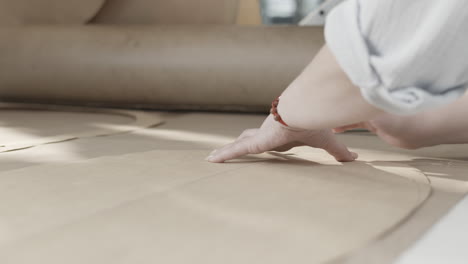 person working on fabric patterns