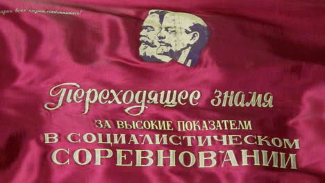 red soviet parade flag with marx and lenin flies full frame