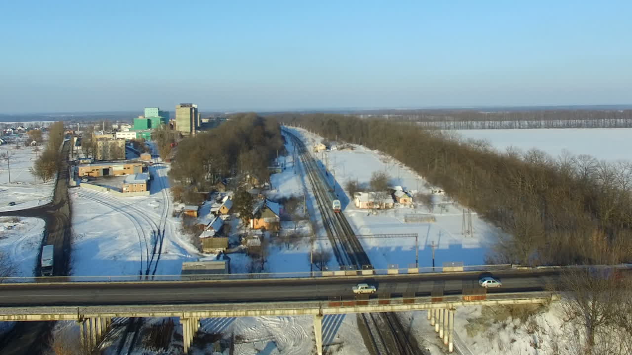 Winter view of the railroad tracks. Fast train passing by in railroad track