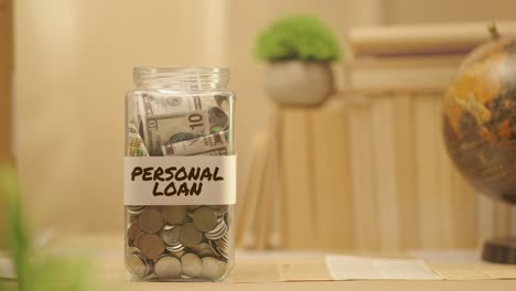 person saving money for personal loan