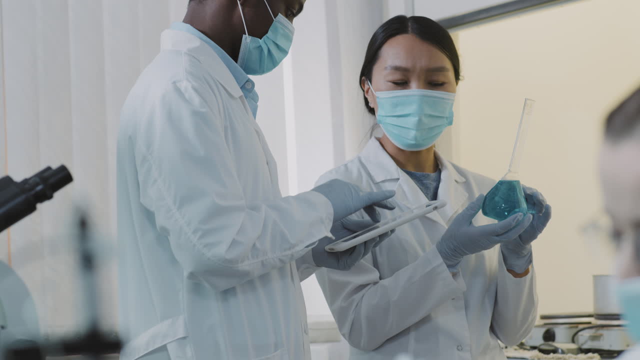 Two Scientists Working on Research in Lab