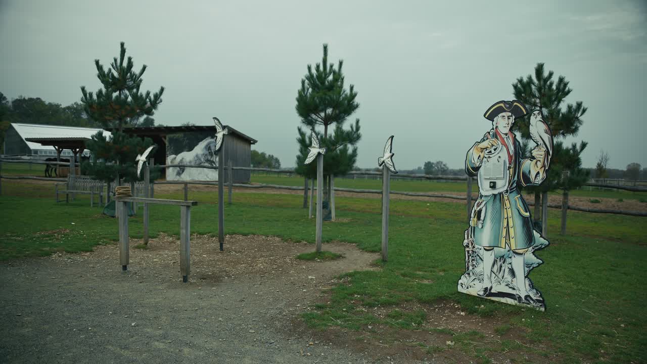 historical themed outdoor display with a soldier cutout and bird sculptures at Schloss Hof, Austria