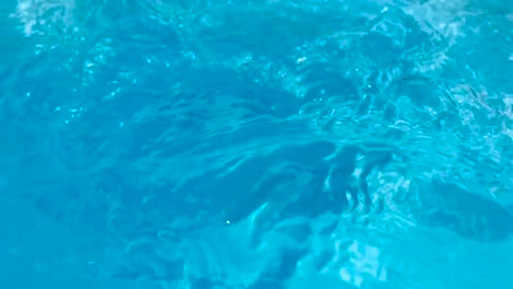 closeup of crystal clear arctic blue water purification in slow motion