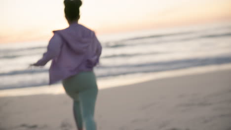 back, freedom and energy with a woman at the beach