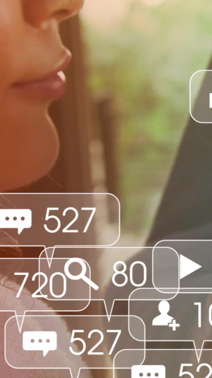 Vertical video: Woman viewing tablet, icons rising around pair, showing marketing engagement