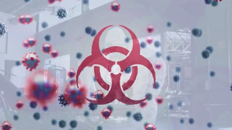 Biohazard-symbol-and-covid-19-cells-over-group-of-health-workers-cleaning-the-gym-using-disinfectant