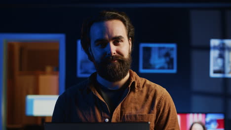 portrait of joyful developer writing lines of code on notebook, close up