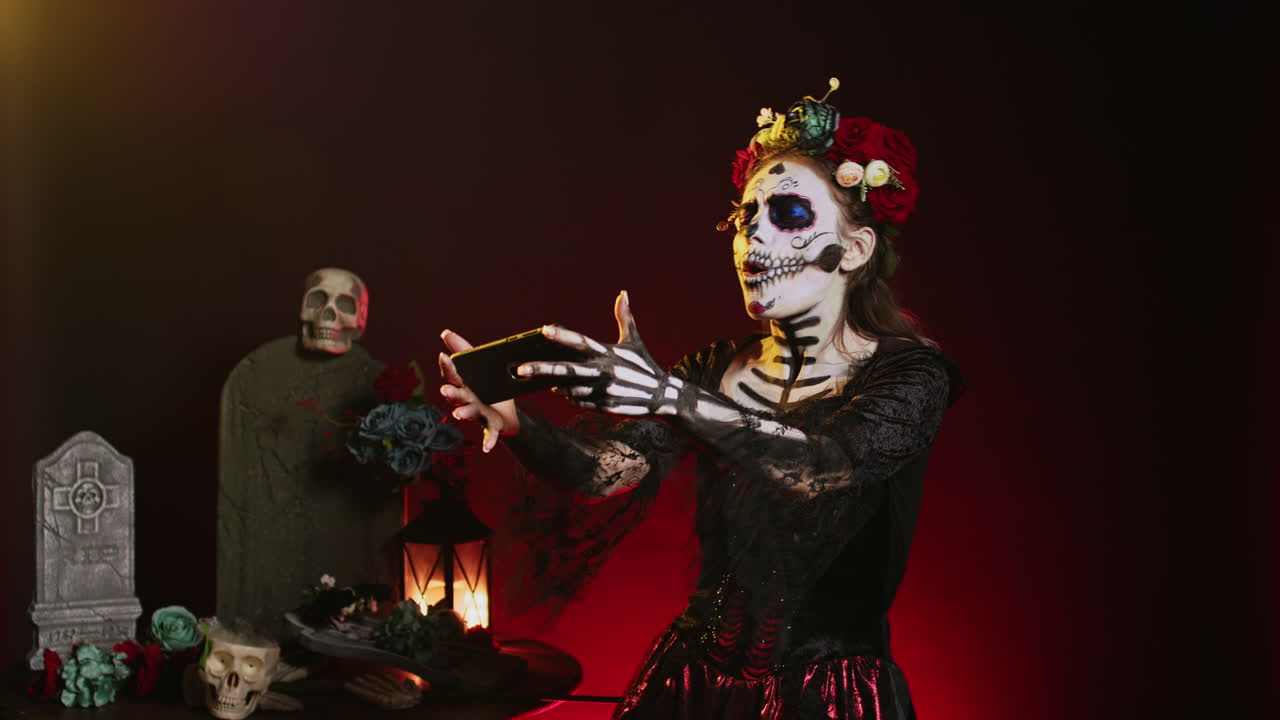 Woman in Day of the Dead Makeup Using Smartphone