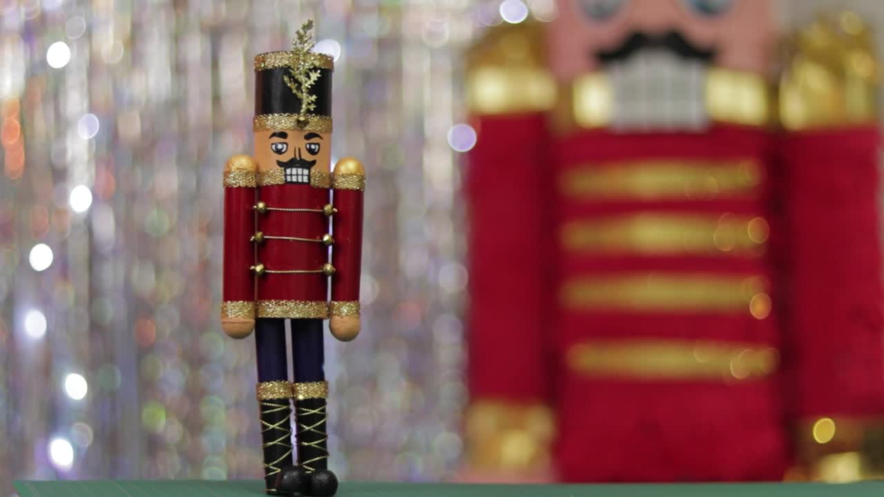 Christmas toy soldier nutcracker, same huge figurine in background