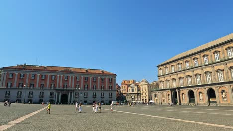 visitors walk through historic naples square