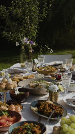 abundant outdoor feast in a garden setting