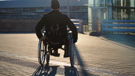 man in wheelchair outdoors