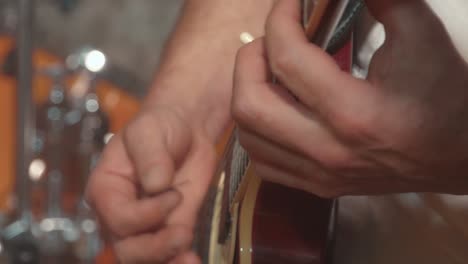 guitarist plays the guitar as part of the band