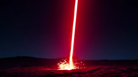 Red Laser Beam Impacting a Desert Landscape at Night