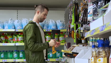 man shopping for tools in a hardware store