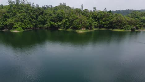 Drone-shot-of-Kayaking-on-a-Lake-and-revealing-the-lake