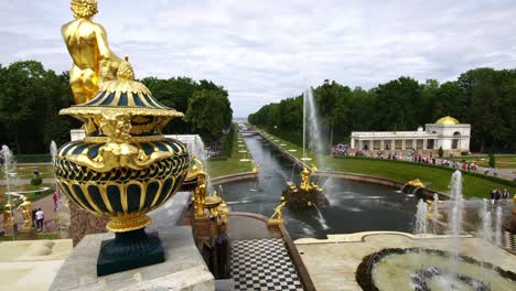 tracking shot showing fountains, sculpture and vase at the grand palace park peterhof, saint petersburg, russia