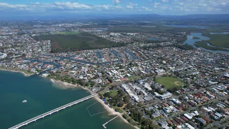 panoramic view over paradise point suburbs in gold coast, queensland, australia - drone shot