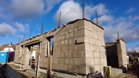 panning up from a hempcrete block to an unfinished hempcrete wall of a building