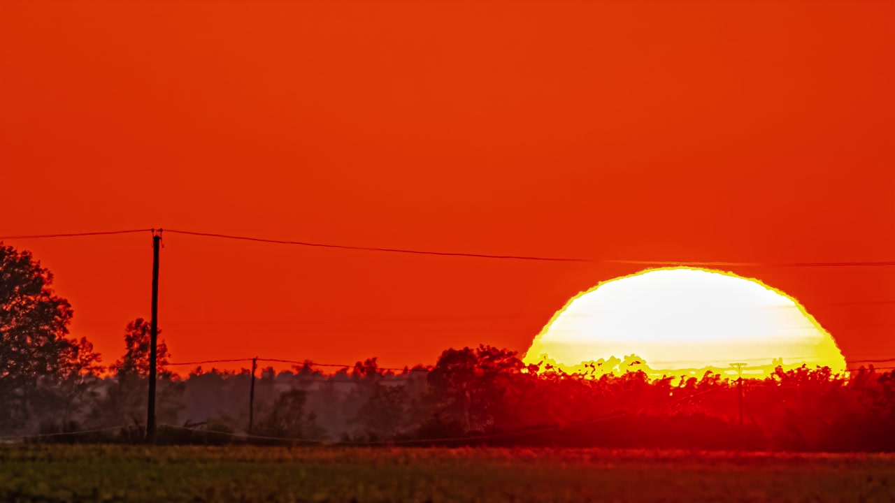 Red sunset sky captured in dramatic timelapse sequence