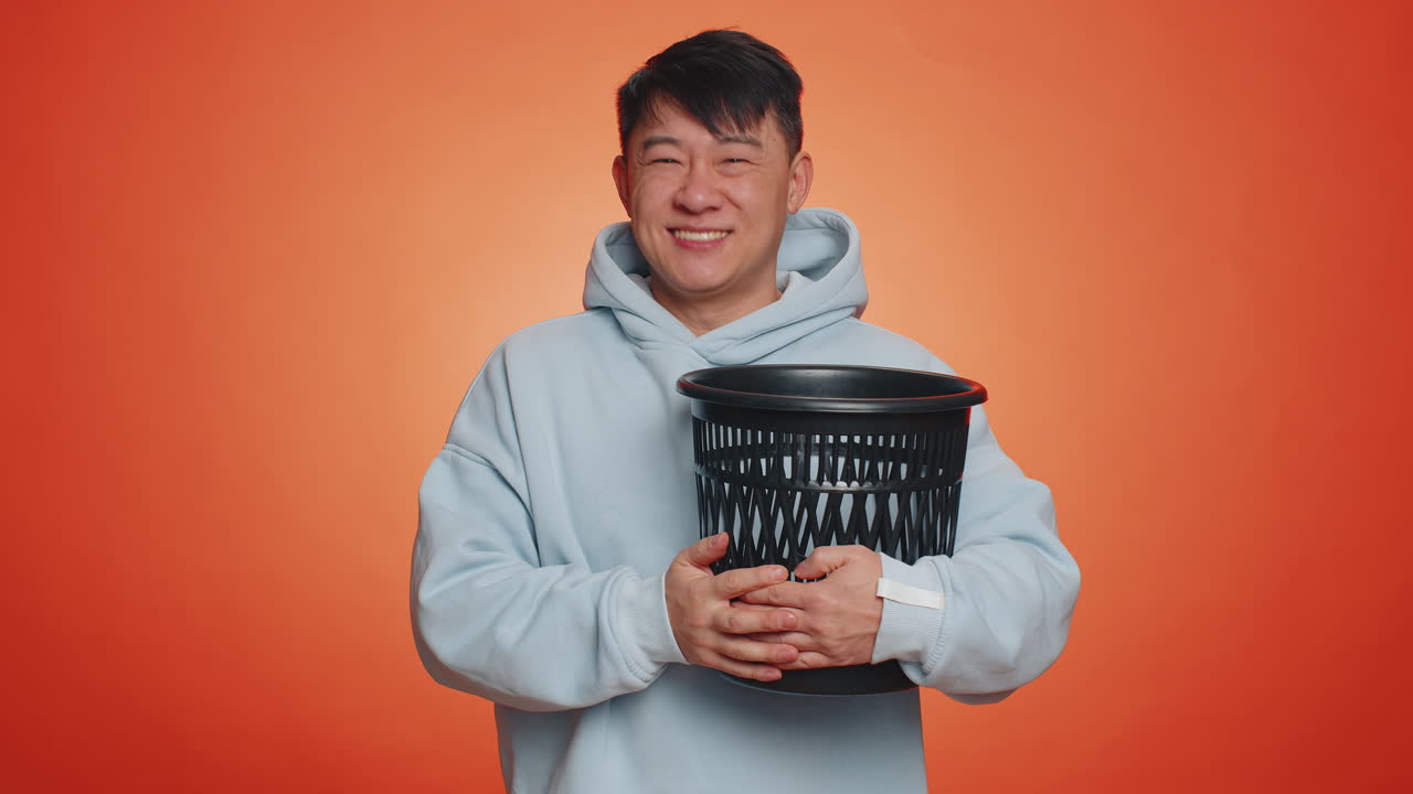 Man taking off throwing out glasses into bin after medical vision laser treatment therapy surgery