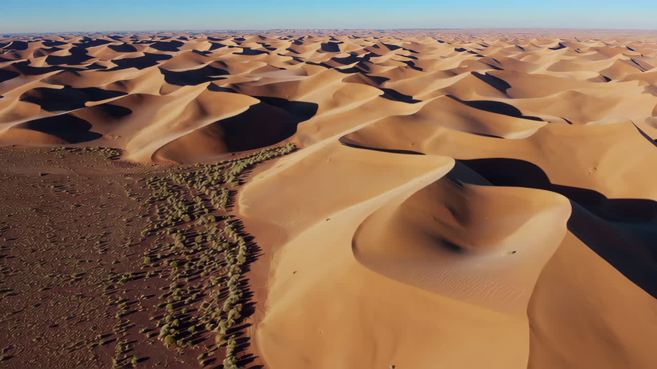 Aerial View of Sand Dunes in a Desert