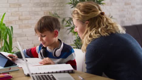 video of happy mother and son spending time over homework