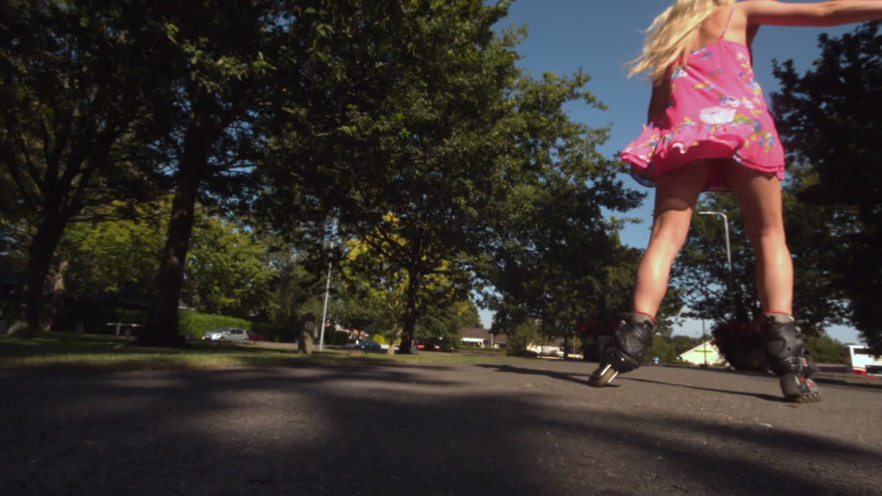 Toned blonde skating in park