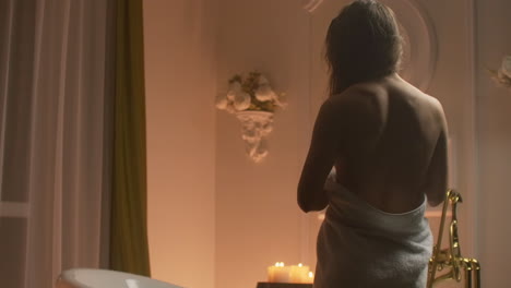 a person standing in front of a mirror. high quality footage