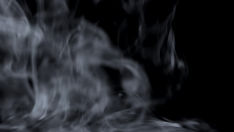 dry ice clouds overlay background. white abstract smoke slowly floating through black surface. atmospheric fog haze effect. real mystery steam. halloween concept footage.