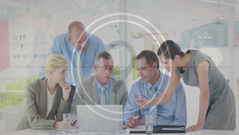 animation of movie countdown from 15 to 6 in circles, diverse coworkers discussing reports on laptop
