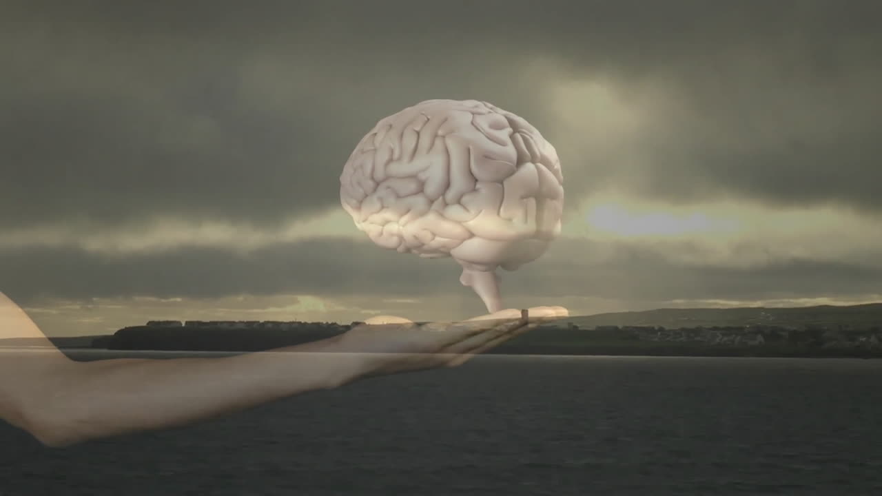 Holding floating brain, human hand in animation over cloudy seascape background