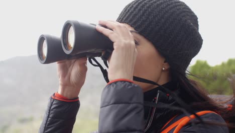 Happy-smiling-woman-enjoying-a-misty-hike